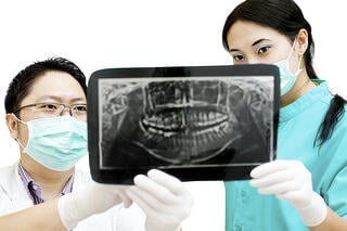 bigstock-Dentist-And-Assistant-Checking-35884303-2